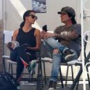 Rocker Tommy Lee and his fiance Sofia Toufa stop by a car wash in Calabasas, California on May 12, 2016. Tommy sat by himself and sent some text messages before returning to Sofia's side - 454 x 504