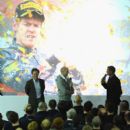 L-r Mark Webber, Christian Horner, Sebastian Vettel, David Coulthard and Adrian Newey speak with the team at the Red Bull Factory on November 27, 2012 in Milton Keynes, England