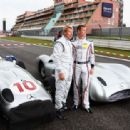 (L-R) Former McLaren team mates Mika Hakkinen and David Coulthard are seen together with historical Mercedes race cars before the German Formula One Grand Prix at the Nurburgring on July 24, 2011 in Nuerburg, Germany - 454 x 313
