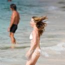 Melissa George – In white bikini on the beach in St. Barts - 454 x 680