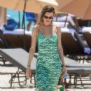 Behati Prinsloo -In a green dress in Miami Beach