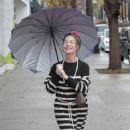 Claudia Wells – Shopping in the rain in Studio City - 454 x 681