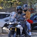 Diane Kruger with Norman Reedus riding a motorcycle in Malibu