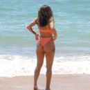 Kayleigh Morris – In orange bikini on the beach in Cyprus - 454 x 514