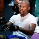 Floyd Mayweather Jr. (L) works out with Nate Jones at the Mayweather Boxing Club on September 2, 2014 in Las Vegas, Nevada - 420 x 594