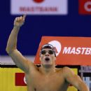 Daniel Gyurta of Hungary celebrates winning the final of the Men's 200m Breaststroke in a world record time of 2:00:48 during the FINA Swimming World Cup at Hamdan Sports Complex on August 31, 2014 in Dubai, United Arab Emirates - 432 x 594