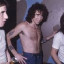 Phil Rudd, Bon Scott, and Malcolm Young of AC/DC, backstage at the Bondi Lifesaver in Sydney, Australia; July 2, 1977