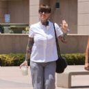 Janine Lindemulder speaks with reporters outsidet the Lamoreaux Justice Center to hear an expected ruling on visitation rights in her child-custody battle with ex-Jesse James. Lindemulder is fighting for visitation rights with their 6-year-old daughter - 396 x 594