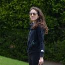 Troian Bellisario – Out for a walk with her dog in Los Angeles - 454 x 568