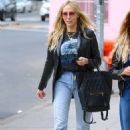 Tish Cyrus – Is walking with a friend in Soho