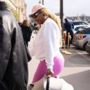 Serena Williams – Carries her baby as she arrives to attend Paris Fashion Week
