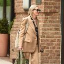 Naomi Watts – Is pictured with her pooch in New York