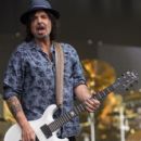 Phil Campbell from Motorhead performs on The Pyramid Stage during the Glastonbury Festival at Worthy Farm, Pilton on June 26, 2015 in Glastonbury, England - 399 x 600