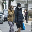 Suki Waterhouse and Robert Pattinson – Wearing matching face masks in London