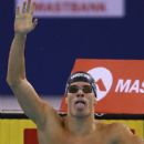 Daniel Gyurta of Hungary celebrates winning the final of the Men's 200m Breaststroke in a world record time of 2:00:48 during the FINA Swimming World Cup at Hamdan Sports Complex on August 31, 2014 in Dubai, United Arab Emirates - 409 x 594