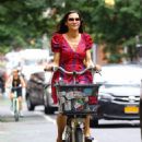 Famke Janssen – Wears colorful dress while out for a bike ride in New York