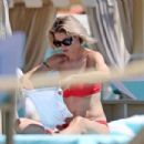 Michelle Hunziker – Seen in Red Bikini at Alpemare Beach in Forte Dei Marmi, Italy - 454 x 303