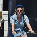 Saoirse Ronan – With Jack Lowden are seen riding bikes in East London - 454 x 594