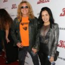 Steven Adler and Carolina arrive at the special screening of 