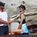 Paris Hilton – In a blue Louis Vuitton sarong with Carter Reum in Lake Como