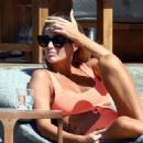 Laura Anderson – Seen in a coral swimsuit in Mykonos - 454 x 328