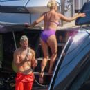 Caroline Stanbury – Seen In a purple bikini with her husband Sergio Carrallo at Mykonos - 454 x 681