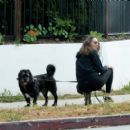 Troian Bellisario – Out for a walk with her dog in Los Angeles - 454 x 405