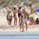 Aurora Ramazzotti – In a black bikini on holiday on the beach in Formentera - 454 x 307