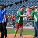Chuck Wicks, Jonas Baade and Bret Michaels greet at City of Hope’s 25th Annual Celebrity Softball Game at the new First Tennessee Park during CMA Music Festival in Nashville.
