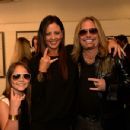 Aubrey Evans, Sara Evans and Vince Neil attend the 2014 CMT Music Awards at Bridgestone Arena on June 4, 2014 in Nashville, Tennessee. - 454 x 349