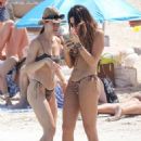 Aurora Ramazzotti – In a black bikini on holiday on the beach in Formentera - 454 x 682