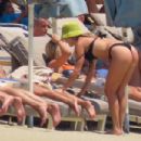 Ashley Roberts &#8211; In a black bikini with Janette Manrara on the beach in Mykonos