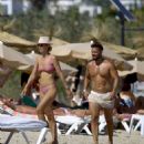 Vogue Williams – Spotted in a pink bikini on the Ibiza beach