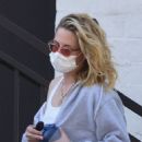 Kristen Stewart – Leaves in her dirty Porsche after a visit to a hair salon in trendy Beverly Hills