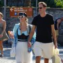 Paris Hilton – In a blue Louis Vuitton sarong with Carter Reum in Lake Como