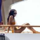 Zoe Kravitz – Spotted in orange bikini aboard a yacht in Positano – Italy