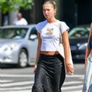 Lila Grace Moss – In crop top, black skirt and Adidas trainers in New York - 454 x 668
