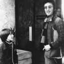 John Lennon and May Pang with his son Julian, LA Dec 1973 - 454 x 565