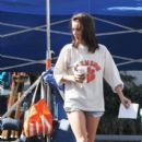 Jessica Stroup: on set with her puppy as she refuels with a coffee in Los Angeles