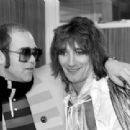 Elton John & Rod Stewart photographed just before Rod went on stage for the third night of his series of London concerts in December 1976 - 454 x 310