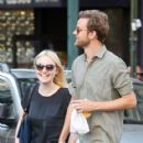 A smitten looking Dakota Fanning and her boyfriend Jamie Strachan go hand in hand for a stroll around New York City - 418 x 594