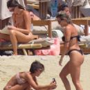 Ashley Roberts – In a black bikini with Janette Manrara on the beach in Mykonos - 454 x 681