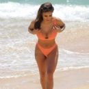 Kayleigh Morris – In orange bikini on the beach in Cyprus - 454 x 611