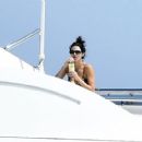 Kendall Jenner – Spotted in a bikini on a yacht in Sardinia