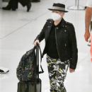 Cyndi Lauper – With husband David Thornton arrive at JFK Airport in New York - 454 x 681