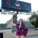 Maitland Ward – Posing at billboard for ‘MUSE’ film on Highland Ave in Hollywood - 454 x 685