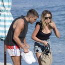 Chloe Lloyd in Black Swimsuit on the beach in Mykonos - 454 x 681