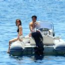 Zoey Deutch in Black Bikini on holiday in Ischia