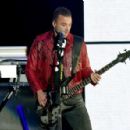Chris Wolstenholme of Muse performs onstage during KROQ Almost Acoustic Christmas 2017 at The Forum on December 9, 2017 in Inglewood, California - 454 x 297