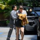 Milla Jovovich – Arrives at the Four Seasons in Los Angeles - 454 x 542